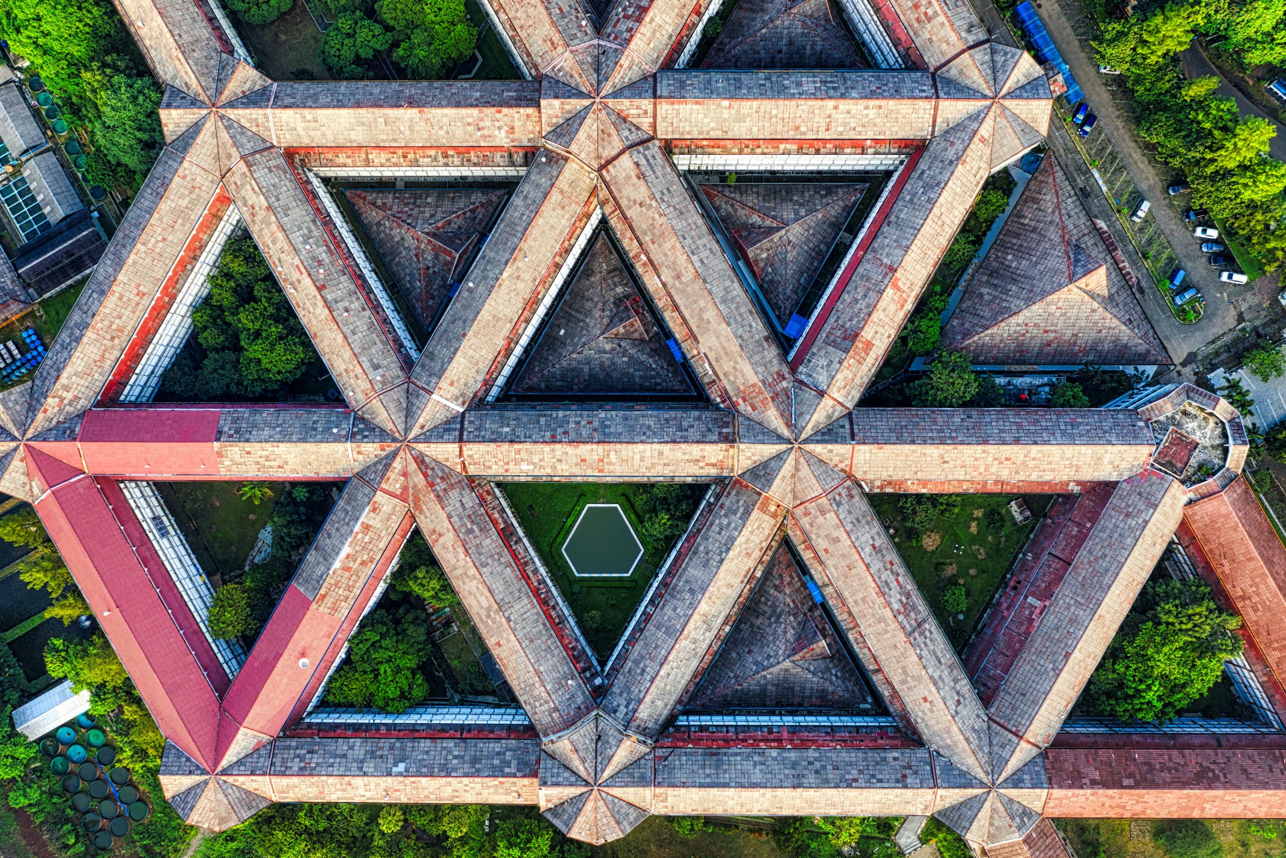 Abstract architectural photo shot from the ground. Features a lot of modern windows and steel.